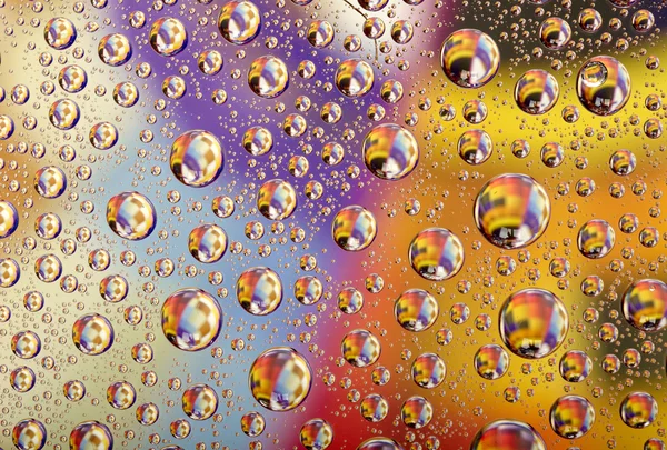 Coloured water drops background — Stock Photo, Image