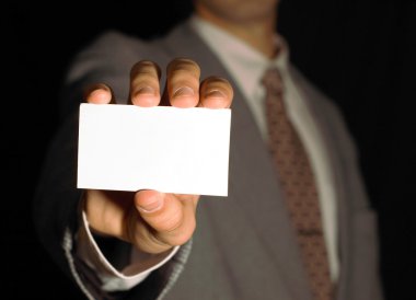 Businesman holding name card on black clipart