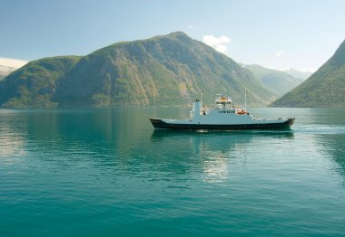 Ferry in the norwegian fjord clipart