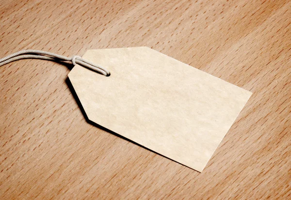 Blank tag on wooden background — Stock Photo, Image