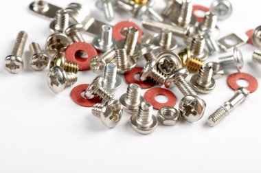 Screws, bolts and nuts on a white backgr clipart