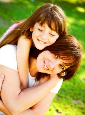 Mother and daughter in park clipart