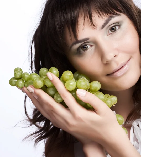 Young woman with green grapes — Stock Photo, Image