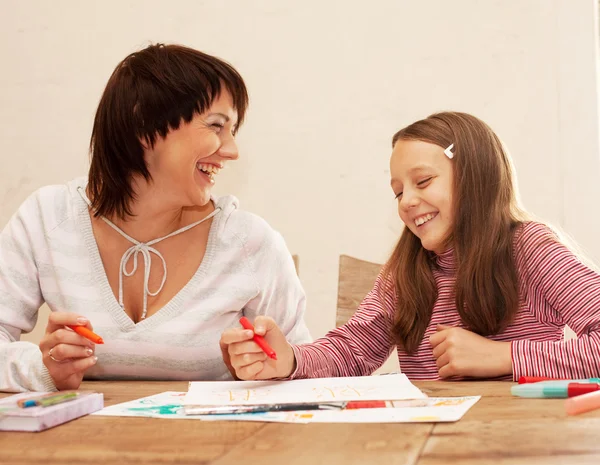 Mother and her daughter drawing. — Stock Photo, Image