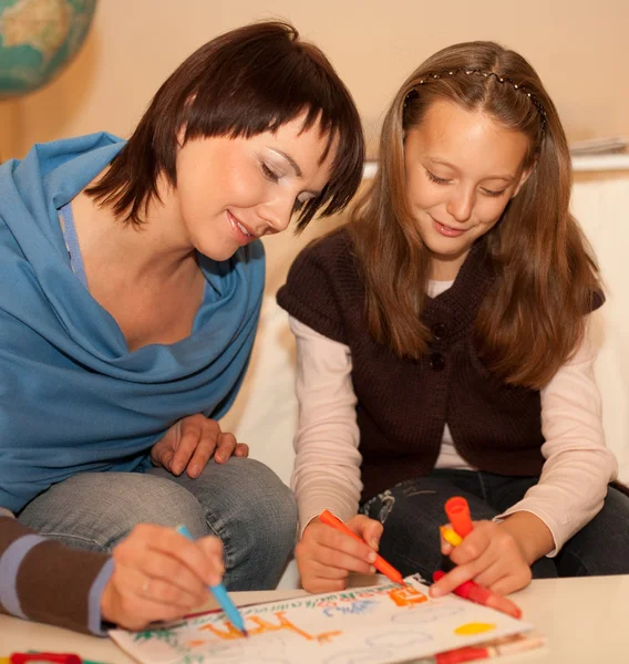Mother and her daughter drawing. — Stock Photo, Image