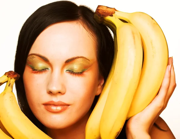 Brunett med bananer — Stockfoto
