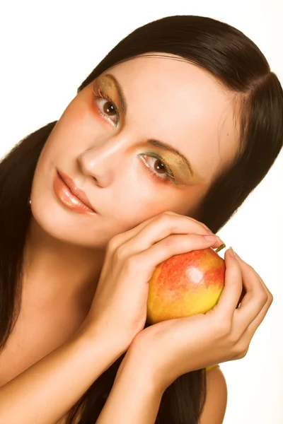 Frau mit Apfel lizenzfreie Stockbilder