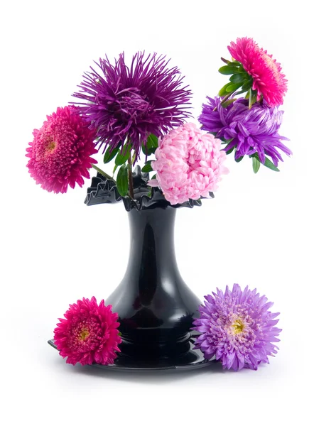 Black vase with bouquet — Stock Photo, Image