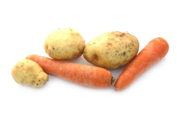 stock image Carrots and an early potato