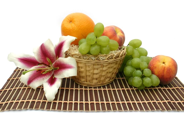 Flower of a lily and fruit — Stock Photo, Image