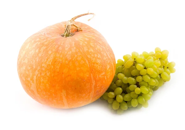 Pumpkin and green sweet tasty grapes — Stock Photo, Image
