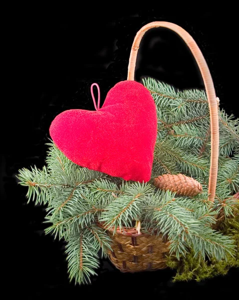 Red heart in basket with tree — Stock Photo, Image