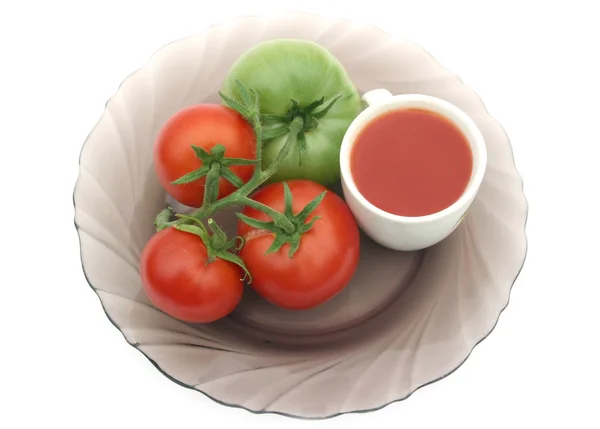 Tomaten en een groene tomaat — Stockfoto