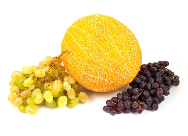 Yellow melon and tasty grapes — Stock Photo, Image