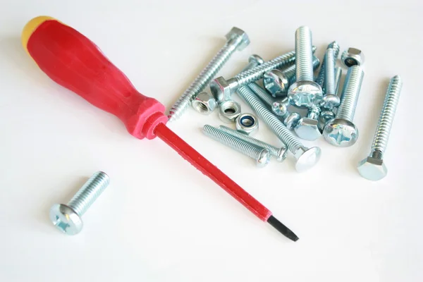 Turn-screw with nails and bolts — Stock Photo, Image