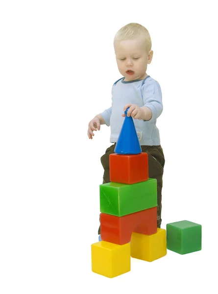 stock image The small child building a tower