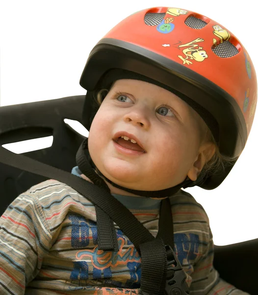 Het kleine kind in een fiets helm Stockfoto