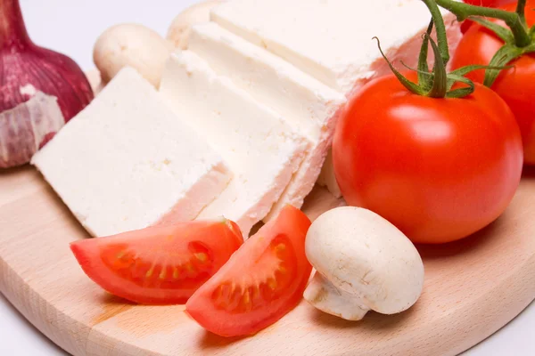 Feta cheese with tomato and mushrooms — Stock Photo, Image