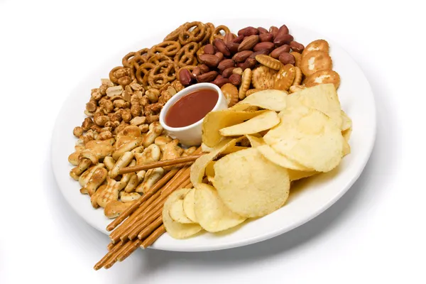 Bramborové chipsy a slané občerstvení Stock Snímky