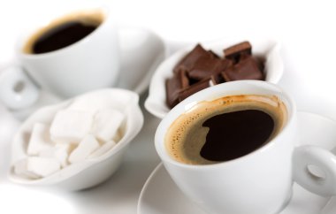 Espresso coffee with sugarcubes and choc clipart