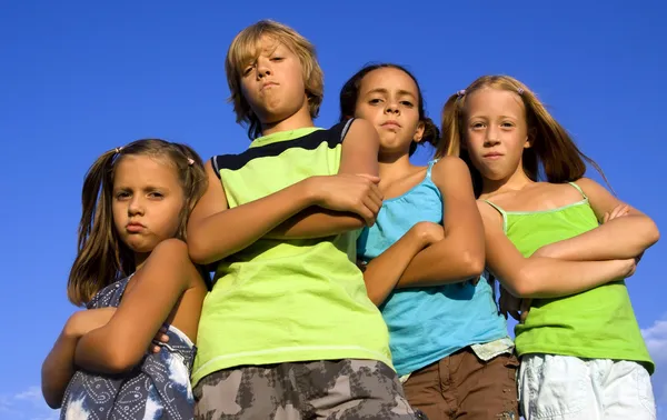 Gang of four serious kids — Stock Photo, Image