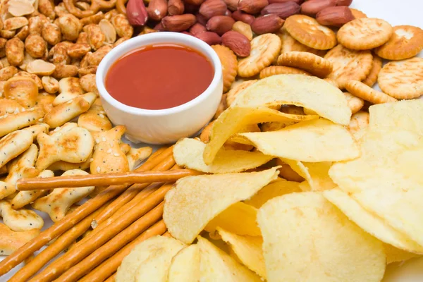 Potato chips and salty snacks Stock Photo