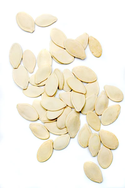 Гарбузове насіння ізольоване на білому — стокове фото
