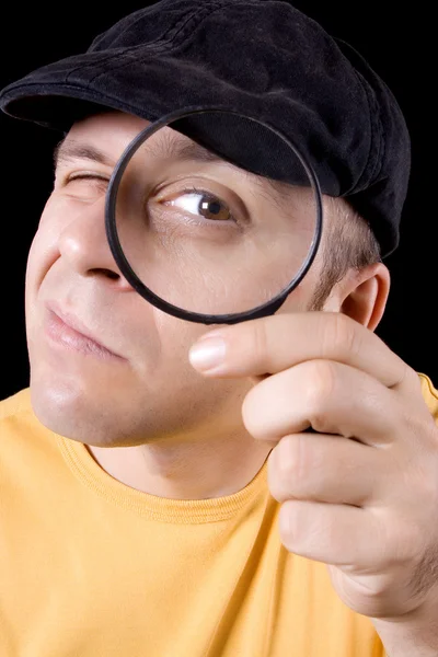 Stock image Detective with magnifying glass