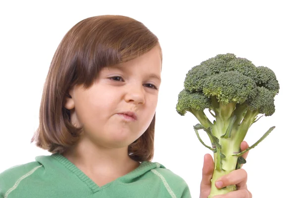 Niño con brócoli — Foto de Stock