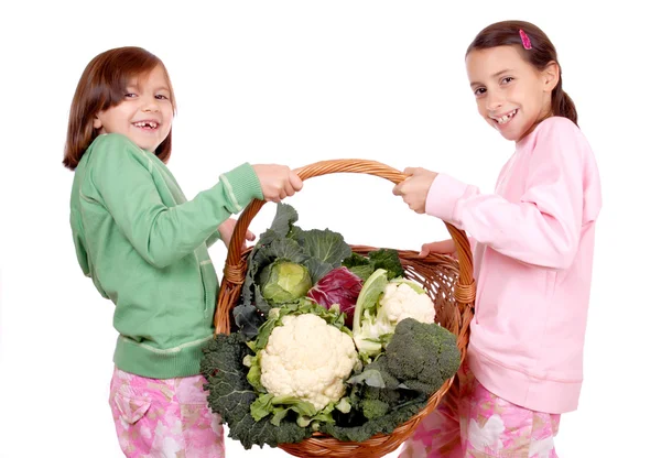 Young girls with vegetables — Stock Photo, Image