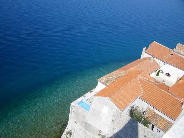 stock image Red roof at the Adriatic sea background