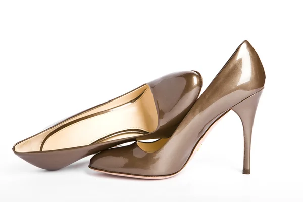 Kobieta beżowo złoty nowe lakierowane buty — Zdjęcie stockowe