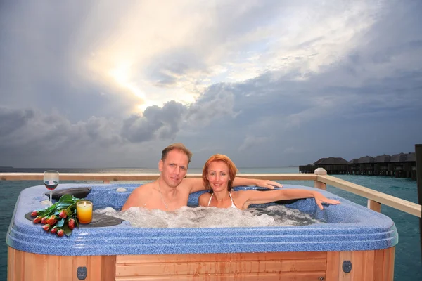 Men and woman in jacuzzi — Stock Photo, Image