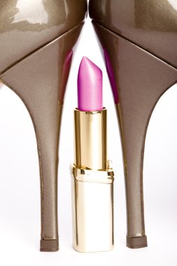 Pink lipstick between l heels clipart