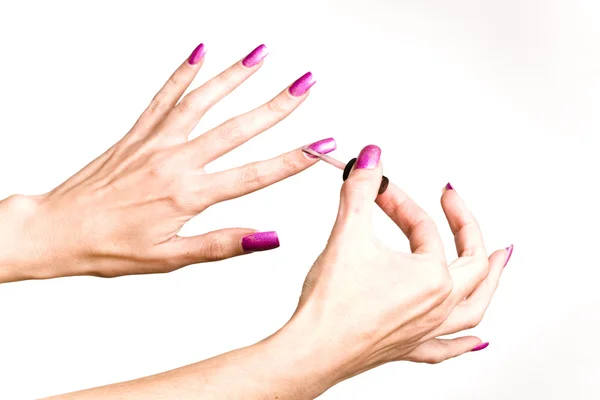 The young woman paints with long nails — Stock Photo, Image