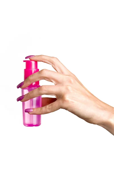 La mano femenina con los medios cosméticos —  Fotos de Stock