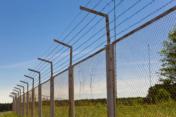 Fence with a barbed wire — Stock Photo, Image