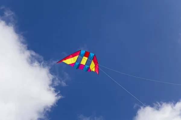 Kite on background of dark blue sky — Stock Photo, Image