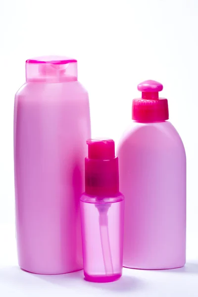 Garrafas cor de rosa para cosméticos — Fotografia de Stock