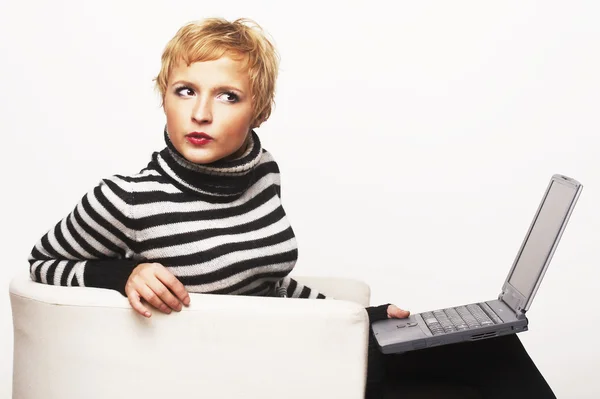 stock image Blondgirl sitting on chair with laptop