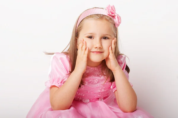 Miła młoda dziewczyna w różowym na jasnym tle Obrazek Stockowy