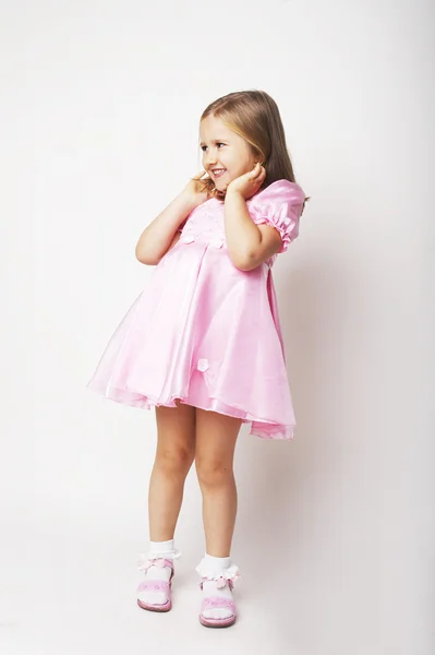 Szép fiatal lány, Pink-ra könnyű háttér Stock Kép