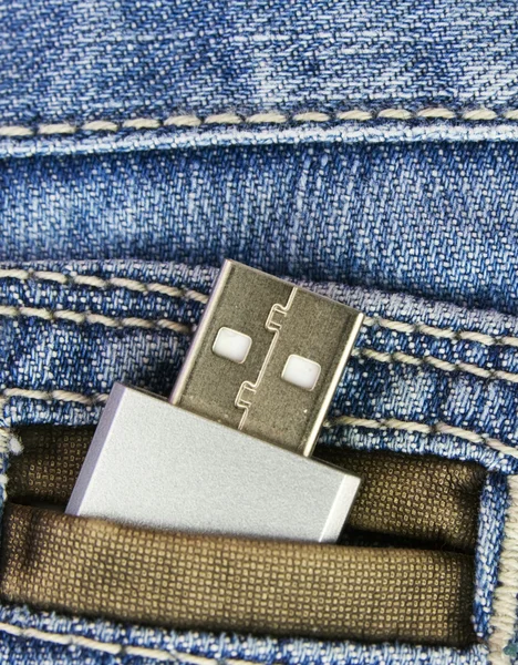 USB flash in jeans pocked — Stockfoto