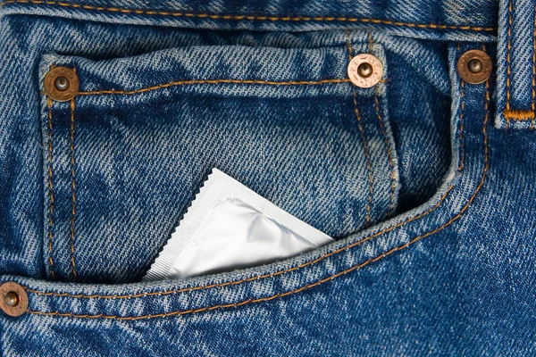 stock image Condom in the pocket of a blue jeans