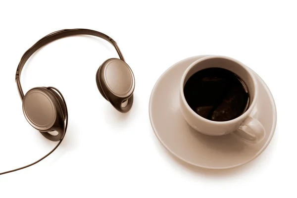 Isolated cup of coffee with headphones — Stock Photo, Image