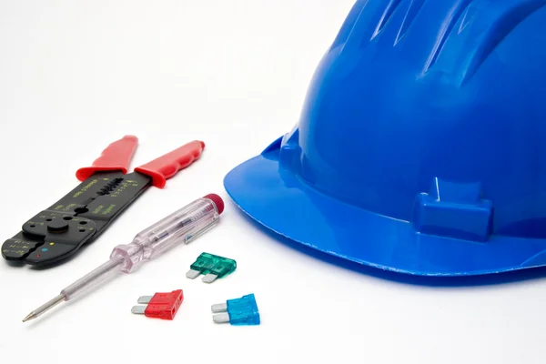 Capacete azul de segurança e ferramentas para os trabalhadores — Fotografia de Stock
