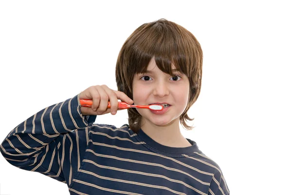 Rapaz escovar os dentes, isolado em branco — Fotografia de Stock