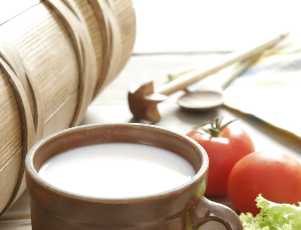 Fresh milk in a clay pot in the backgrou — Stock Photo, Image