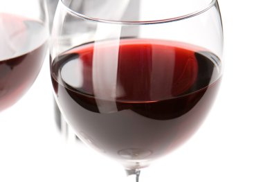 Closeup on glass of red whine clipart