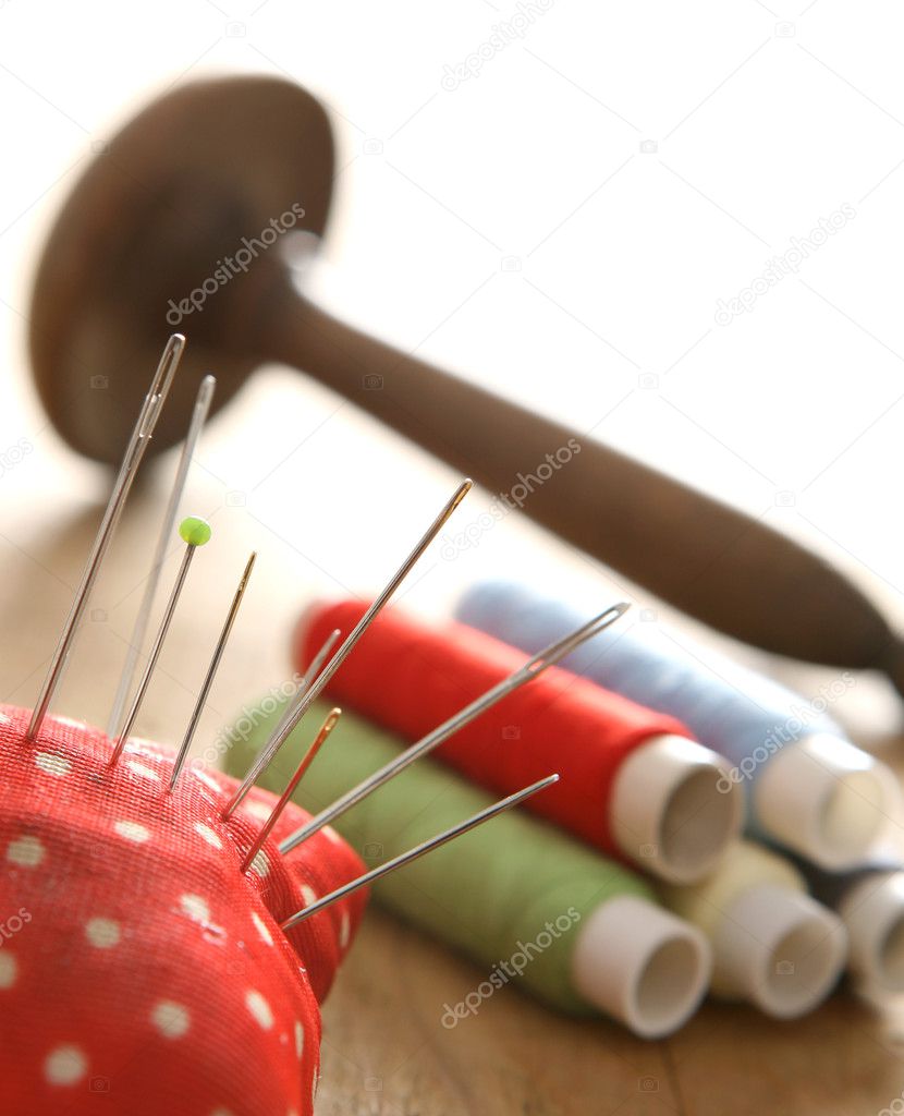 Colorful thread spools and needle